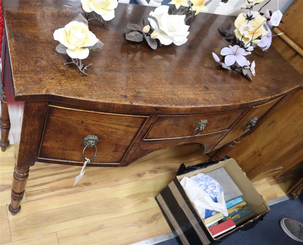 A small Regency mahogany bow front sideboard, width 107cm, depth 50cm, height 82cm